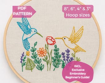 May include: An embroidery hoop featuring a colorful hummingbird design. The design includes a blue and yellow hummingbird, flowers, and foliage. Text on the image reads "PDF Pattern," "8", 6", 4" & 3" Hoop sizes," and "INCL. Exclusive Embroidery Beginner's Guide!"