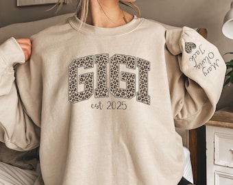 Custom Leopard Gigi Sweatshirt With Kid Name On Sleeve, Personalized Gigi Sweatshirt, Gift For Gigi, Christmas Gift Gigi Est 2025 Sweatshirt