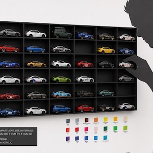 May include: A black rectangular wall-mounted display case with thirty individual compartments, each housing a miniature toy car. The internal compartment size is 9.5cm wide by 4cm high by 4cm deep, constructed from 3mm acrylic material.