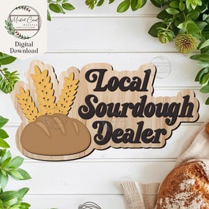 May include: Wooden sign with the text "Local Sourdough Dealer" in black, featuring a loaf of bread and wheat stalks. The sign is light brown with a wood grain pattern. The words "Digital Download" are also visible.