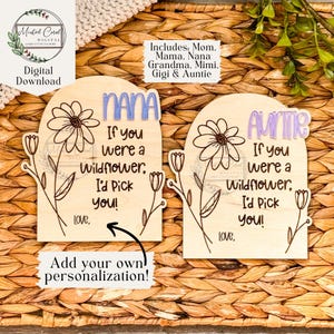 May include: Two wooden signs with a floral design and the text "If you were a Wildflower, I'd Pick You!" One sign says "Nana" and the other says "Auntie".