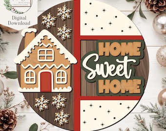 Könnte beinhalten: Runder Holzschild mit Lebkuchenhaus, Schneeflocken und dem Schriftzug "HOME SWEET HOME". Das Schild hat einen braunen Holzmaserungshintergrund, rote Akzente und einen cremefarbenen Bereich mit schwarzen Sternen. Dekoriert mit goldenen und weißen Akzenten.