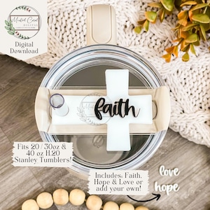 May include: A clear tumbler lid with a white cross-shaped accent and the word "faith" in black script. The lid also features a straw and a logo. The text "Fits 20 / 30oz & 40 oz H.20 Stanley Tumblers!" is visible.