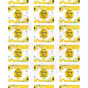 May include: A set of 18 printable labels featuring a yellow honeycomb pattern with a sunflower and a bee. The text on the labels reads "A little honey bee is on the way".