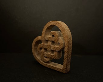 Celtic love knot hand carved from oak in the UK