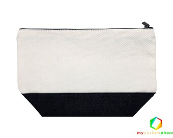 May include: A white canvas zippered pouch with a black bottom. The pouch is made of a woven fabric.