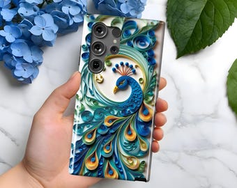 May include: A smartphone case featuring a vibrant peacock design. The case showcases a peacock with blue, teal, and yellow details against a white background. The design is intricate and detailed, with a textured appearance. The case has a glossy finish and a camera cutout.