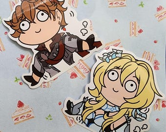 Puede incluir: Dos pegatinas de dibujos animados de personajes de anime con ojos grandes y expresiones de sorpresa. Los personajes están sobre un fondo azul claro con un patrón de pequeños pasteles blancos.