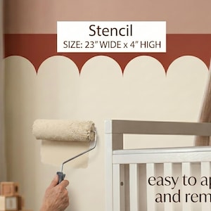 May include: A paint roller applies cream-colored paint to a wall, creating a scalloped border design. The stencil is 23 inches wide and 4 inches high. The text says "easy to apply and remove."