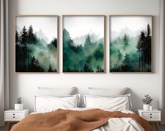 May include: Three framed watercolor paintings of a misty forest scene with dark green trees and a white background.
