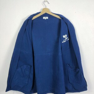 May include: A navy blue jacket with a full zipper and two front pockets. The jacket is hanging on a wooden hanger. The inside of the jacket has a white logo and the text "SPORTLINE" printed on the upper right side.