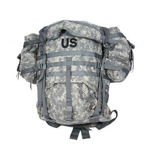 May include: A camouflage backpack with a large main compartment and several smaller pockets. The backpack has a US patch on the front.