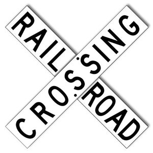 May include: Black and white sign with the words "RAILROAD CROSSING" in a diagonal pattern.