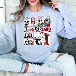Puede incluir: Una sudadera gris claro con un dise&ntilde;o de c&oacute;mic de Jack y Sally de The Nightmare Before Christmas. El dise&ntilde;o incluye el texto "I'm Jack", "I'm Sally", "Jack N Sally" y bocadillos con "Hi Sally" y "Hi Jack".