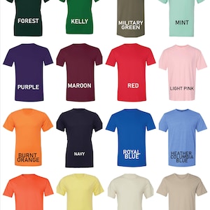 May include: A chart of 16 different t-shirt colours, including forest, kelly, military green, mint, purple, maroon, red, light pink, burnt orange, navy, royal blue, heather columbia blue, orange, yellow, natural, and tan.