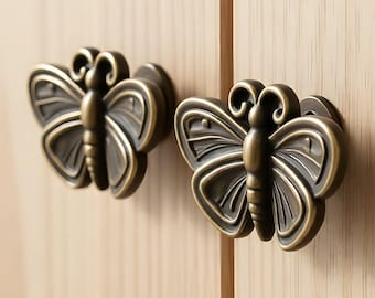 4 tiradores de cajón con forma de estrella de mar y mariposa, de latón.