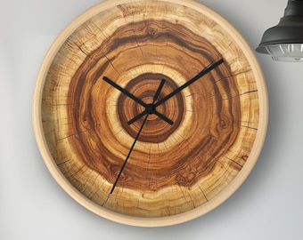 May include: A round wooden wall clock with a wood grain design. The clock face has black hands and a black outline.