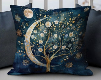 May include: A blue throw pillow with a gold crescent moon and a white flowering tree design. The background is a dark blue with gold glitter accents.