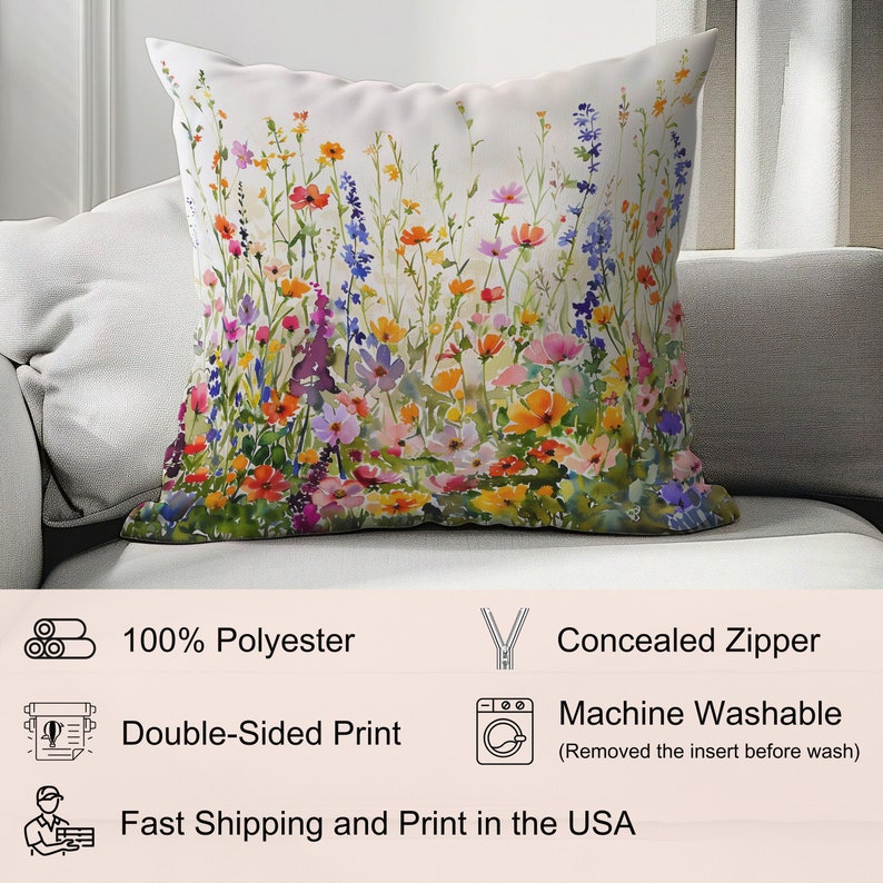 May include: A white throw pillow with a colorful floral print featuring a variety of flowers in shades of pink, red, orange, yellow, blue, and purple. The pillow has a concealed zipper and is made of 100% polyester. It is machine washable.