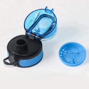 May include: A blue and black water bottle lid with a removable filter. The lid has a flip-top design and a carrying handle.