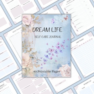 May include: A "Dream Life Self Care Journal" with a blue cover featuring butterflies and floral accents. The journal includes 40 printable pages and is surrounded by other pages with various trackers and checklists.