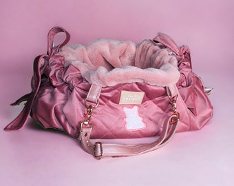 Dog carrier made with soft pink velvet by designer dog. This luxury dog carrier can be also a pink dog bed. The perfect small dog accessory