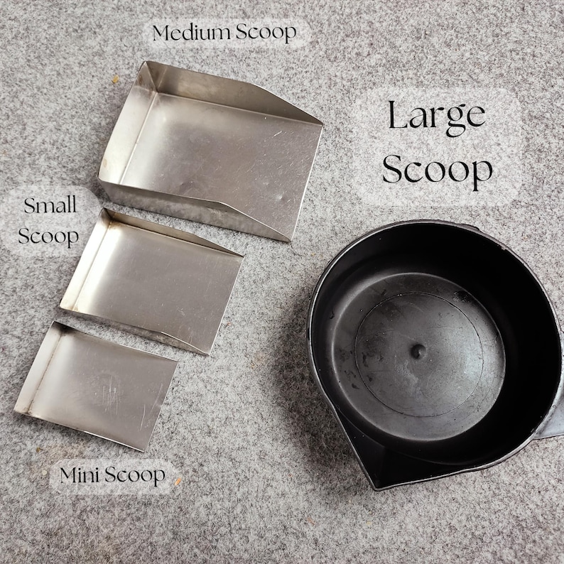 May include: A collection of scoops in various sizes. The image shows a mini, small, medium, and large scoop. The mini, small, and medium scoops are rectangular and made of metal. The large scoop is black and round.