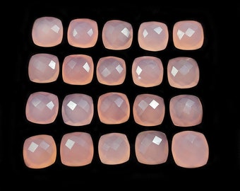 May include: Twenty-four faceted, pale pink gemstone cabochons arranged in four rows of six. The cabochons are smooth and polished.