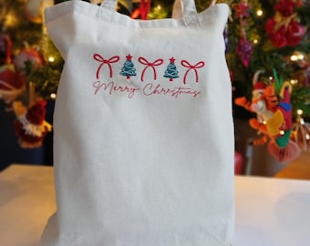 Bolsa de compras con árbol de Navidad y lazos bordados a máquina. Bolsa de compras ecológica de lona de algodón. Bolsa de regalo resistente y festiva.