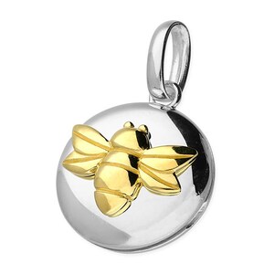 May include: A silver charm featuring a gold bee design. The bee is raised and has a detailed design. The charm is round and has a loop for attaching to a bracelet or necklace.