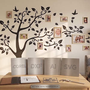 May include: A wall decoration with a black tree design, leaves, and bird silhouettes, with framed photographs. Below, four metal signs show file format abbreviations: Corel, DXF, AI, and SVG. A wooden table holds a notebook and a metal leaf.