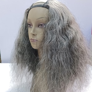 May include: Gray wavy human hair wig with a U-part opening for a natural look. The wig is on a mannequin head.