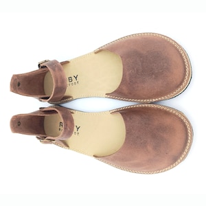 Ruby mink minimalist barefoot handmade soft leather woman sandals are 100% handmade from all sustainable natural materials. Ruby women casual sandals not only have a rich story but also have a unique aesthetic quality, and comfort.