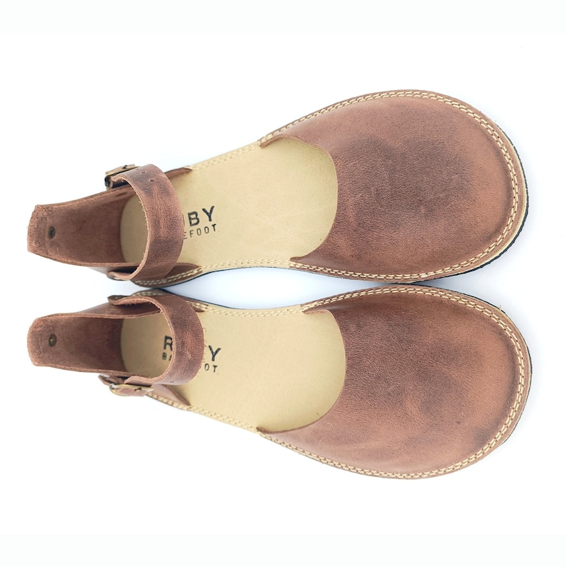 Ruby mink minimalist barefoot handmade soft leather woman sandals are 100% handmade from all sustainable natural materials. Ruby women casual sandals not only have a rich story but also have a unique aesthetic quality, and comfort.