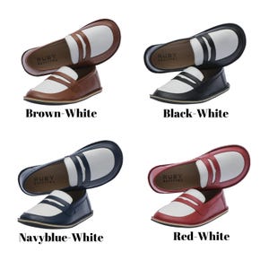 May include: Four pairs of loafers in different color combinations. Each pair features a white upper with a contrasting colored toe and heel. The brand name "RUBY BAKETTOL" is printed on the insole of each shoe.