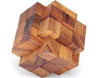 May include: A wooden puzzle made of many small, interlocking cubes. The puzzle is in the shape of a cube, and the cubes are arranged in a complex pattern.