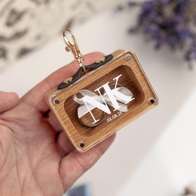 Elegant oak ring box for pets to carry wedding rings.