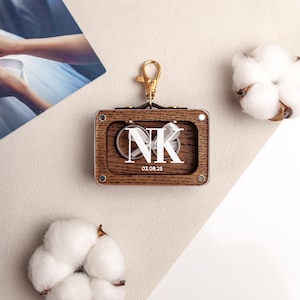 Personalized wooden ring box attached to dog collar.