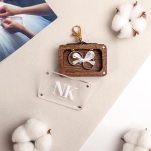 Personalized pet ceremony ring box with secure collar clip.