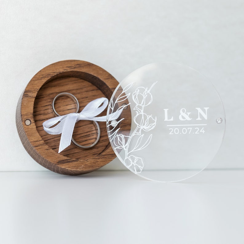 Beautiful oak wood ring box with acrylic lid, ideal for rustic weddings.