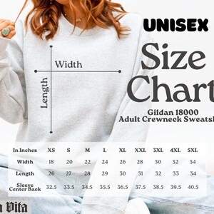 May include: A light gray unisex adult crewneck sweatshirt with a size chart. The chart lists measurements in inches for width, length, and sleeve center back for sizes XS to 5XL. The brand is Stella Vita.