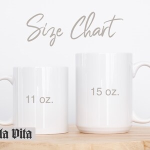 May include: Two white ceramic mugs, one 11 oz and one 15 oz, on a wooden surface. The mugs are blank and ready for personalization.