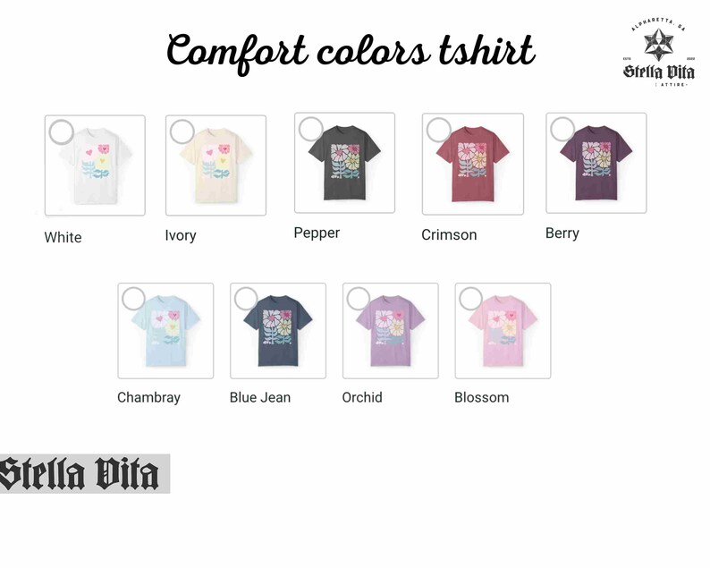 May include: A graphic t-shirt featuring a floral design in shades of pink, yellow, blue, and green. The shirt is available in ten different colours: white, ivory, pepper, crimson, berry, chambray, blue jean, orchid, and blossom.