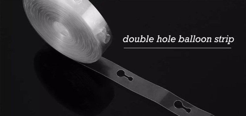 May include: A roll of clear plastic balloon strip with double holes for attaching balloons. The strip is rolled up and a section is unrolled to show the double holes. The text "double hole balloon strip" is printed on a black background.