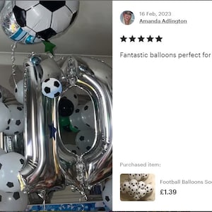 May include: Silver number balloons in the shape of "10" surrounded by black and white soccer ball balloons. The balloons are hanging from the ceiling. The text "Fantastic balloons perfect for my sons birthday" is visible in the image.