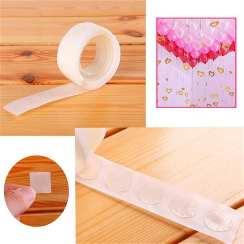 May include: A roll of clear adhesive tape with a dispenser and a close-up of the tape with round adhesive dots. The tape is used for attaching balloons to surfaces.
