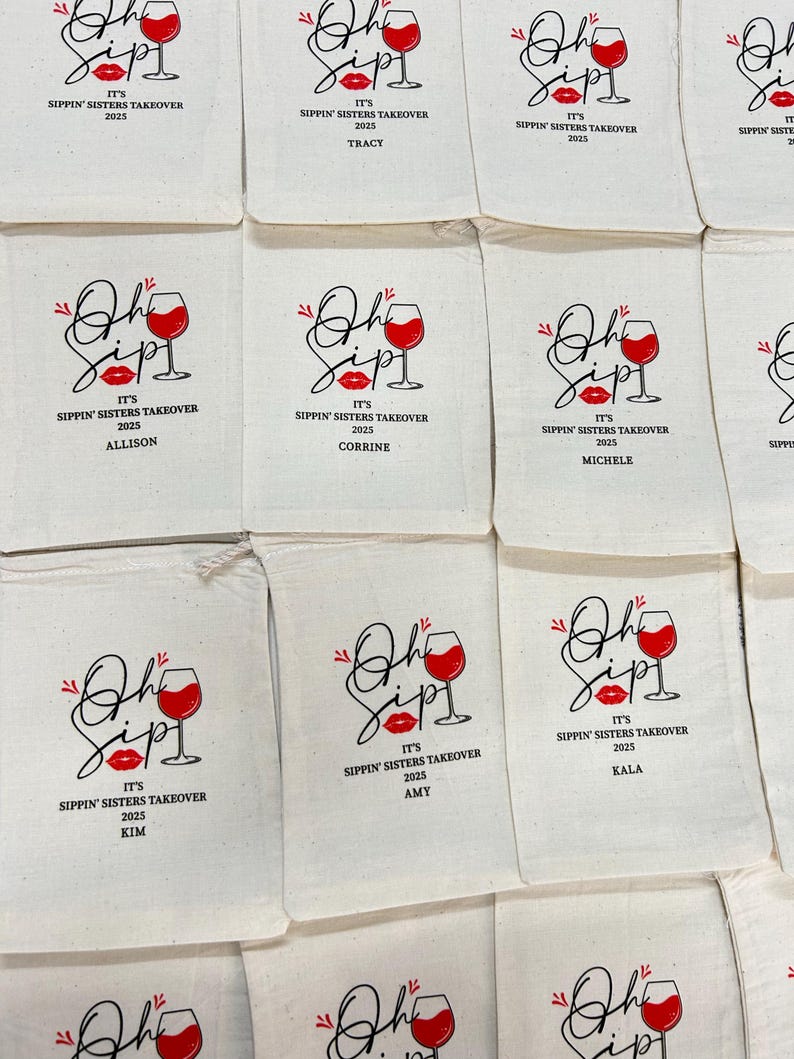 May include: A collection of off-white fabric drawstring pouches featuring a printed graphic of a wine glass and red lips. The text reads Oh Sip! It's Sippin' Sisters Takeover 2025, with individual names like Tracy, Allison, Corrine, Michele, Amy, and Kala.