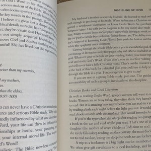 May include: Open book with a white background. The book is open to a page with the title "Discipline of Mind". The text on the page discusses the importance of reading the Bible and other Christian books.