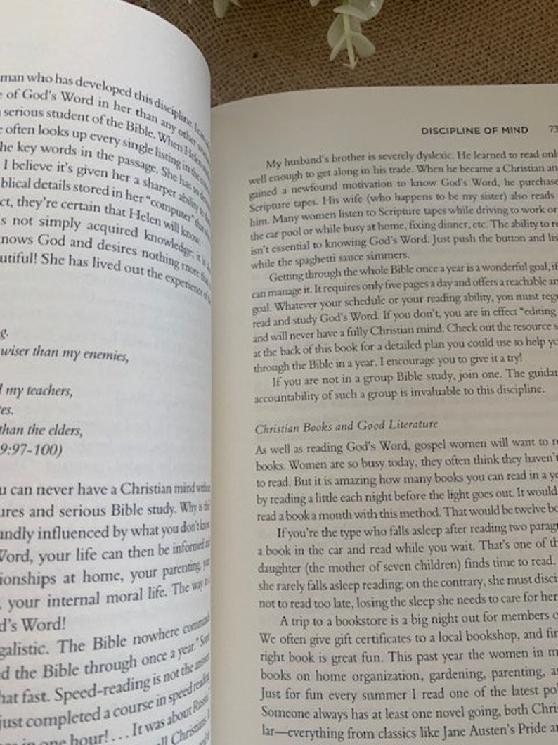 May include: Open book with a white background. The book is open to a page with the title "Discipline of Mind". The text on the page discusses the importance of reading the Bible and other Christian books.
