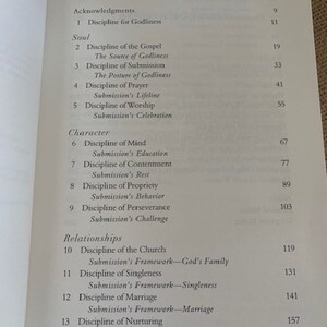 May include: A book titled "Contents" with a table of contents listing chapters and page numbers. The chapters are organized into three sections: "Acknowledgments", "Soul", and "Character".